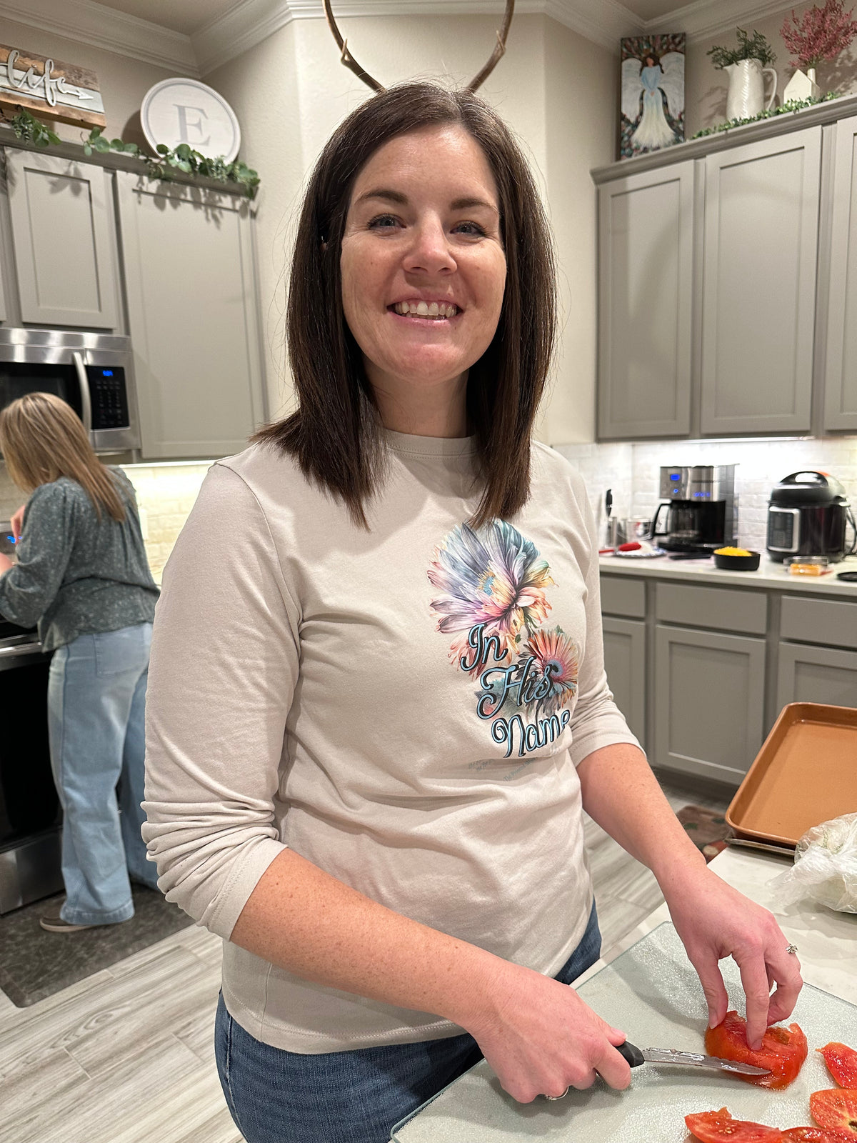 Nicole in the kitchen wearing In His Name