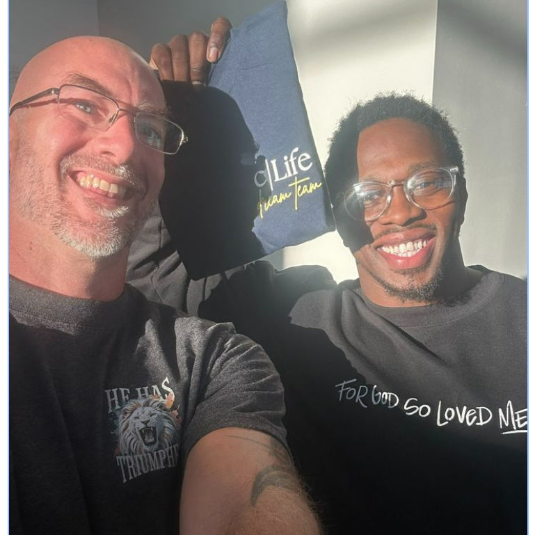 Chad in the He Has Triumphed tee with a friend