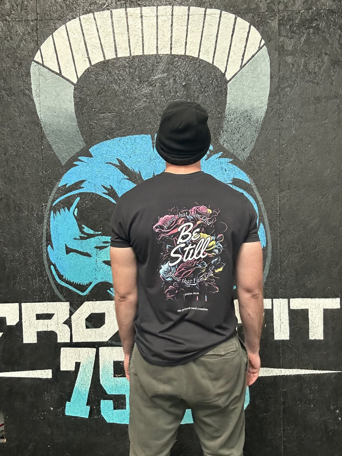 Be Still tee at the gym, back print