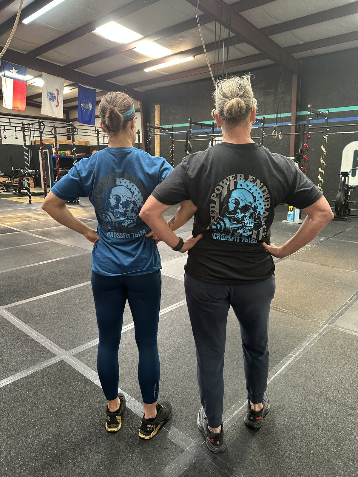 Four CrossFit 75126 members in custom tees and hoodies, back prints