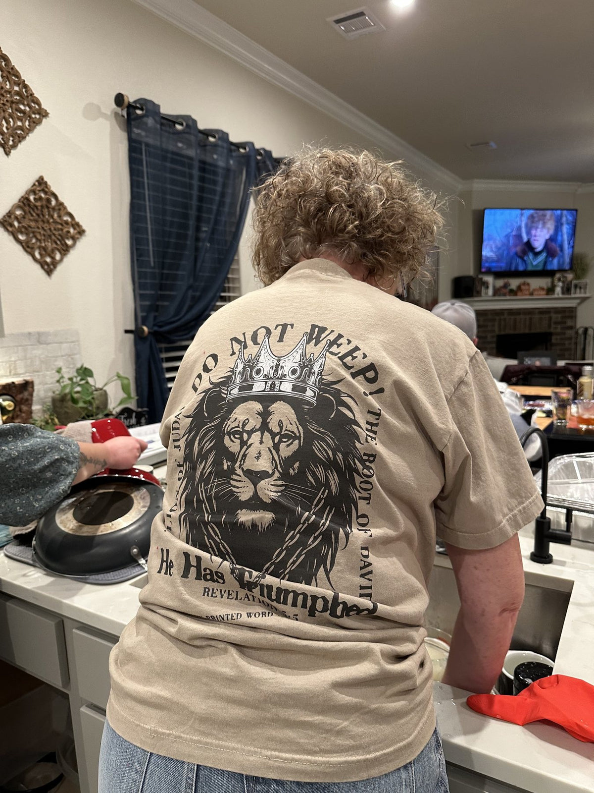 Do Not Weep on a light tee, worn at home