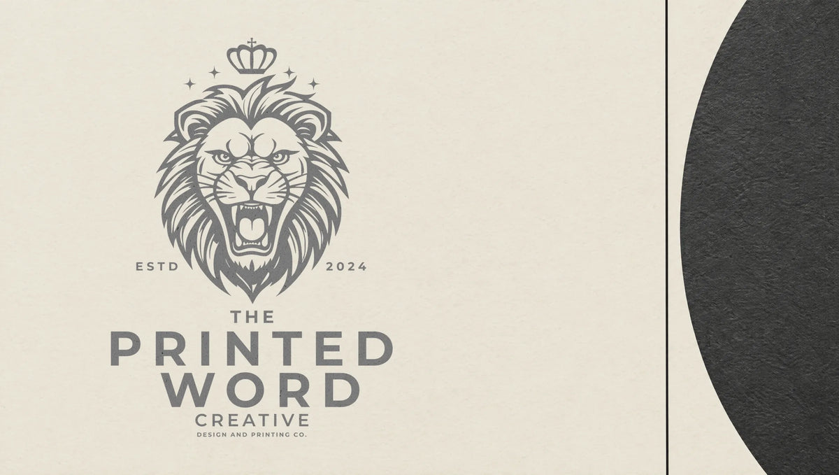 The Printed Word Lion artwork set against a black half-circle on bone